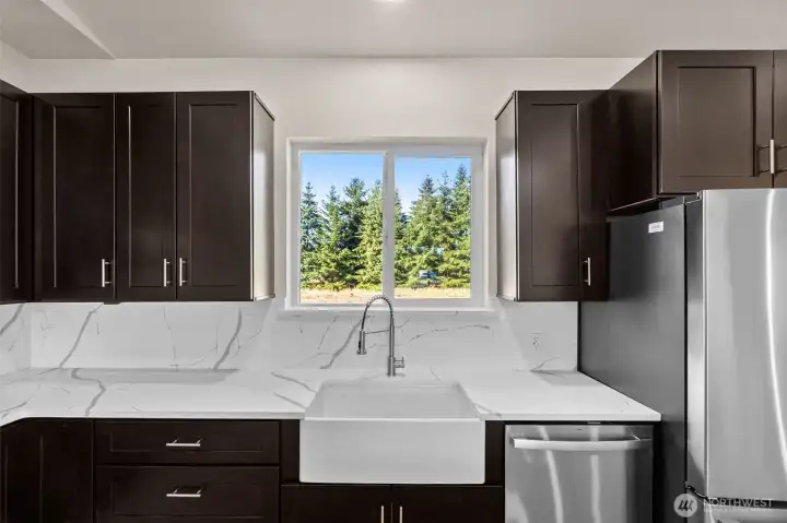 Porcelain farm sink, with view of private, spacious backyard!