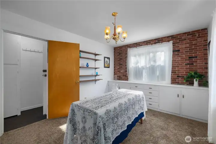 Dining room leading to stairs to basement area.
