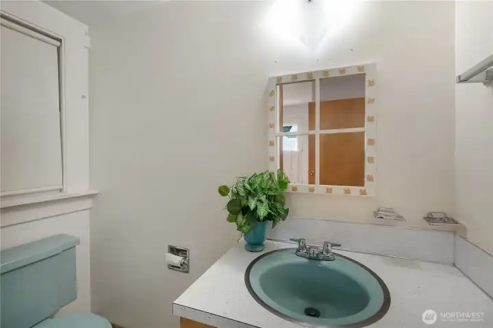 Half bathroom in the primary bedroom.