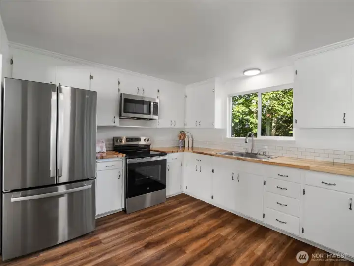 Newly renovated kitchen featuring brand new stainless steel appliances