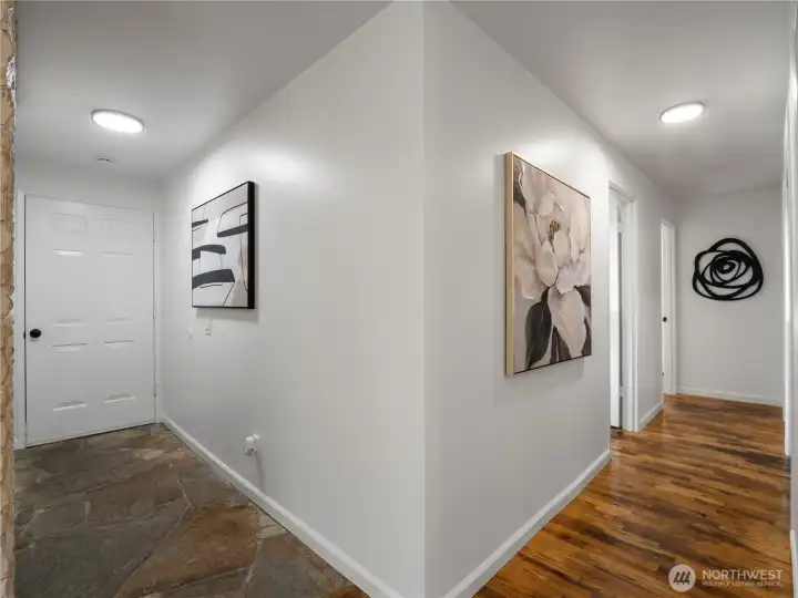 Entryway into hallway that leads back to the bedrooms