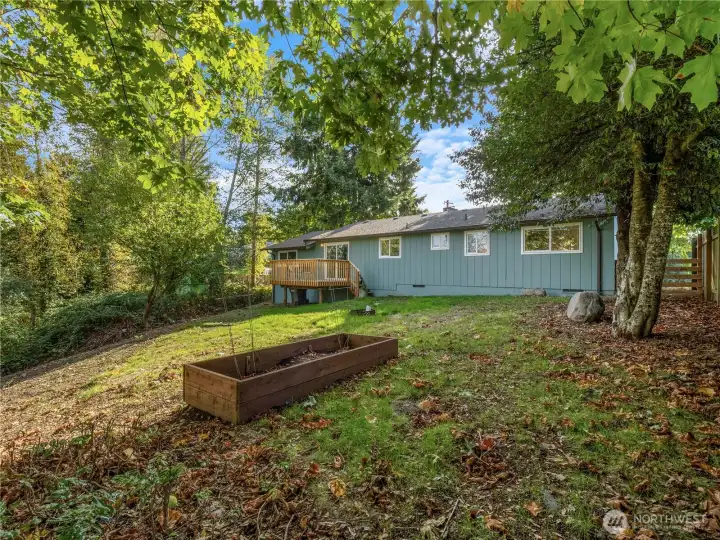 Backyard with garden space and fire pit