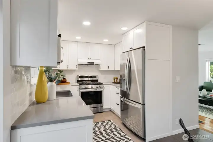 Sellers updated kitchen with new cabinets, countertops, appliances, lighting