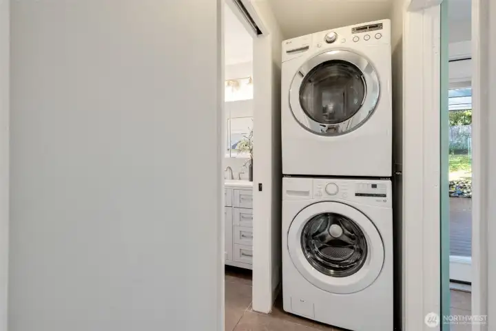 Well-located washer-dryer stack adjacent to sliding barn door