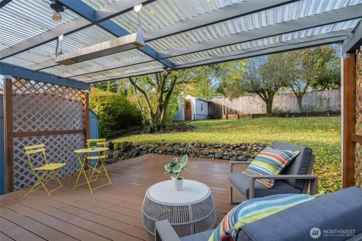 Covered back deck with overhead heaters for year-round outdoor dining