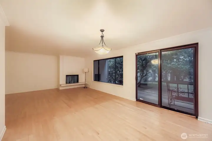 Living room with fireplace and access to patio