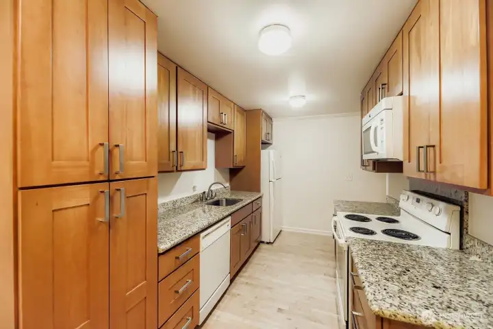 Galley kitchen.  All appliances convey