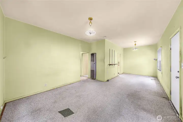 Small house - living room and dining area.  Front door on the right