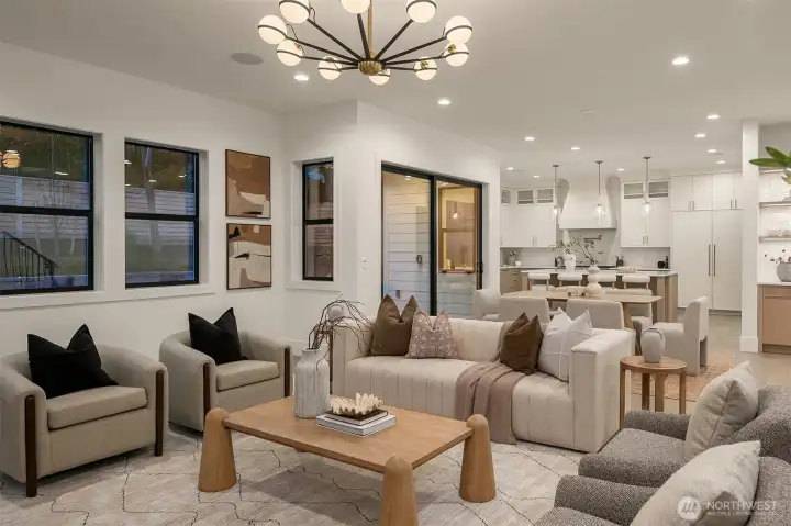 A fully integrated smart home system includes iPad controls, smart doorbell, irrigation, thermostat, Sonos Amp audio, dimmable lighting, Cat-6 wiring, eight ceiling speakers, and motion-activated lighting in pantry, closets, and garage.