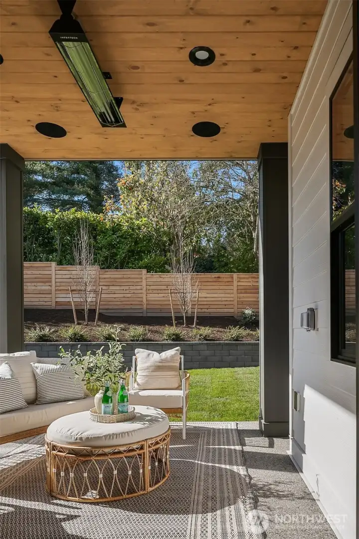 Step outside to a spacious, meticulously manicured, and level backyard, fully fenced for privacy and safety.