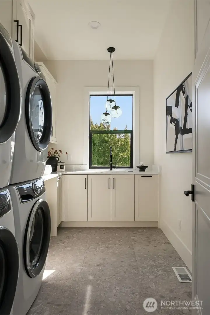 A versatile bonus room with vaulted ceilings, ideal as a media lounge, playroom, fitness space, or additional gathering area.