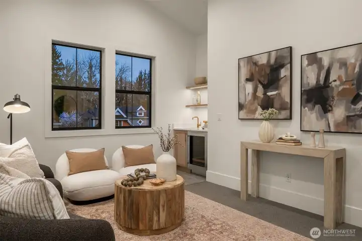 A versatile bonus room with vaulted ceilings, ideal as a media lounge, playroom, fitness space, or additional gathering area.