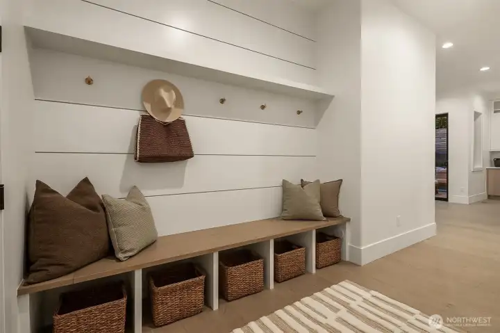 A smartly designed mudroom that keeps life effortlessly organized — ample storage for shoes, coats, and gear makes coming and going a breeze while maintaining a clean, orderly home.
