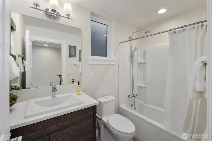 2nd upper floor bathroom of a previous model home in the Avenue plan.  The Courtyard plan also has an upper floor guest bathroom.