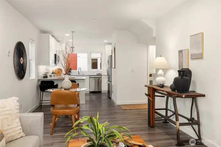 Looking back at the dining/kitchen. Stairs are to the right and Powder room as well.