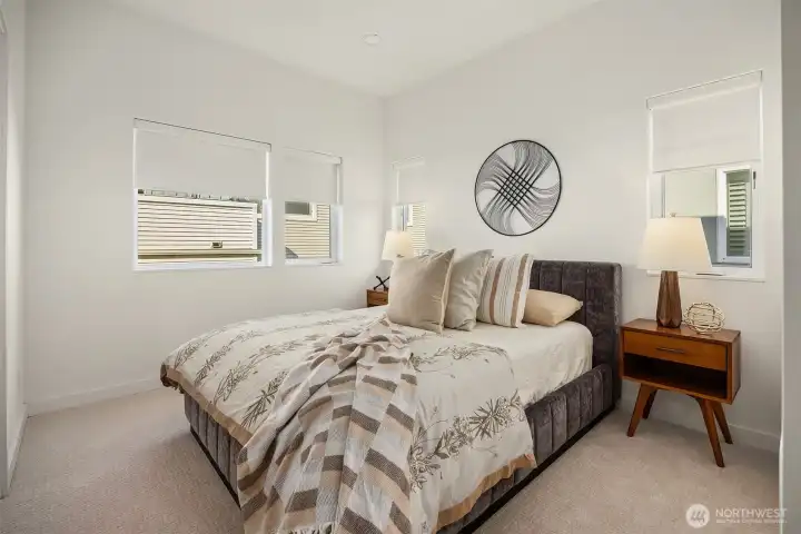 The Primary bedroom boasts brand new carpet and custom blinds.