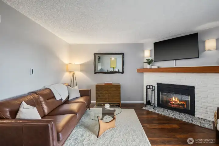 Living room with wood burning fireplace