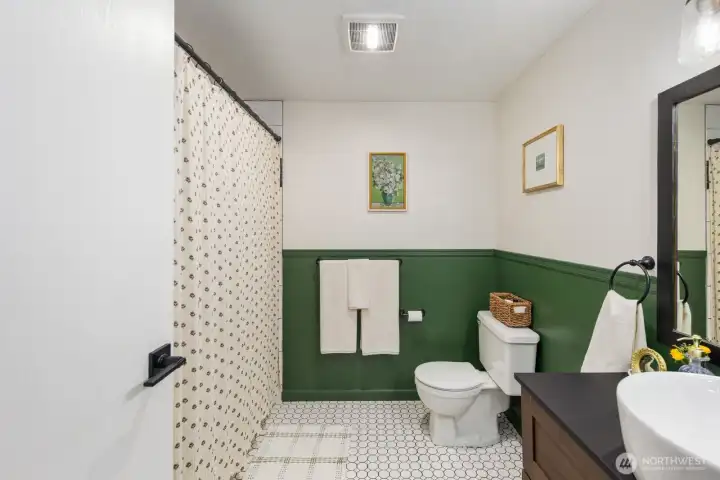Spacious bathroom with tub and shower