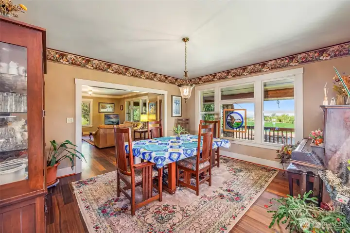 This nice-sized dining room offers plenty of space for gatherings and entertaining. With natural light flowing in from large windows and easy access to the living area, it's the perfect place to enjoy meals while taking in the views.