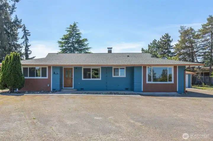 This is a special property with TWO remodeled ramblers, two detached garages and a large workshop on 2.1 scenic acres.