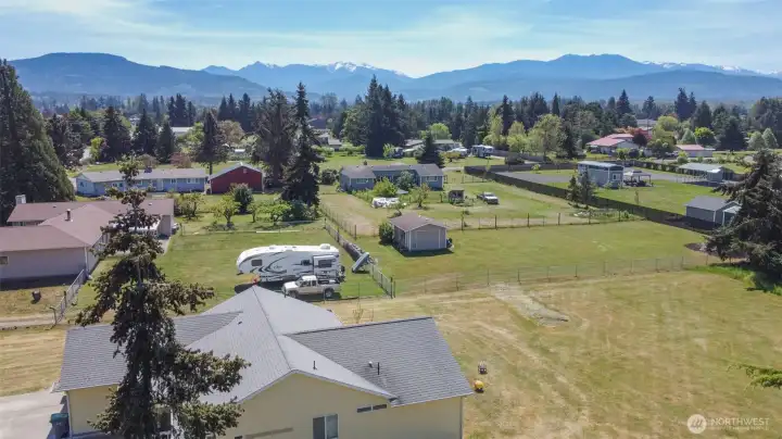 Beautiful grounds with mountain views 2.1 acres with two houses and 2 detached garages and one large workshop
