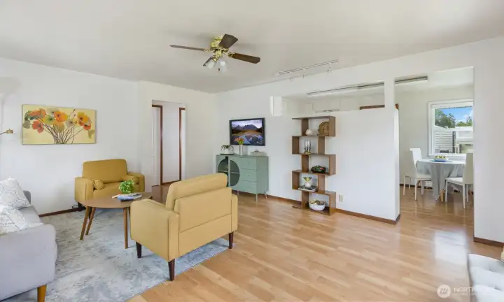Newer laminate floors that are snap-on to gently cover the amazing original oak floors from 1940"s that have been refinished by an italian flooring craftsman.