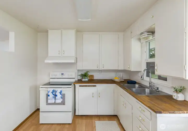 The kitchen has gorgeous butcher block countertops!