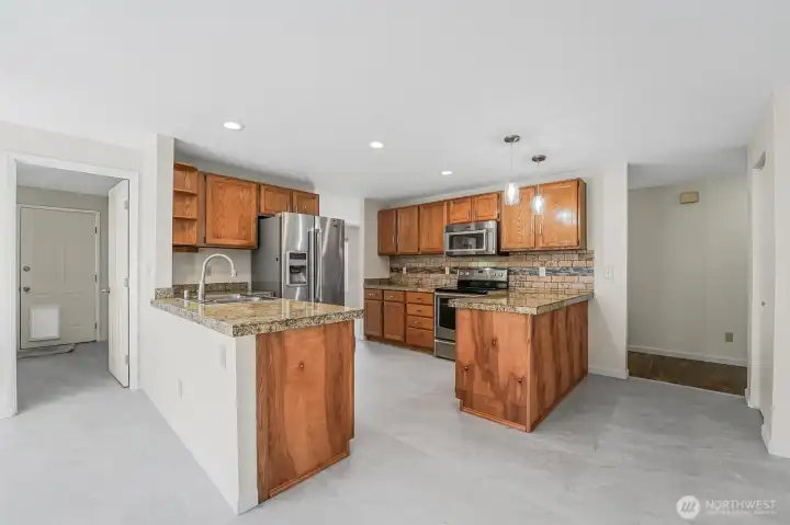 New Luxury Vinyl Tile (LVP) has been installed in the kitchen and dining areas.