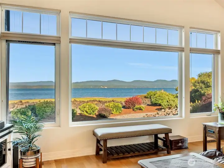 Panoramic water views create a breathtaking backdrop from the main living spaces.
