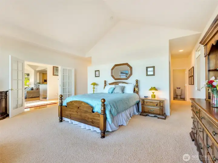 Generously sized primary retreat offering space for a sitting area and direct views of the surrounding landscape.