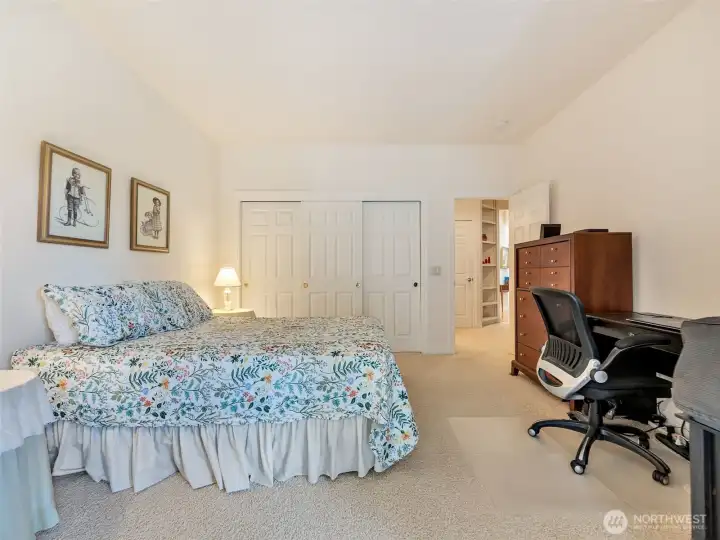 Comfortable guest bedroom with generous closet space and plenty of natural light.