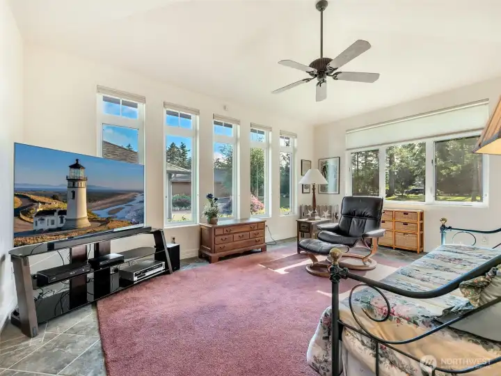 Spacious, adjoining, bonus room surrounded by windows, creating the perfect place to relax while enjoying the beautiful views.