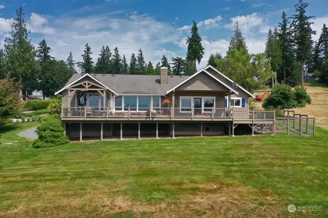 The basement is accessed by an full sized exterior door on the lower level and runs the length of the house.