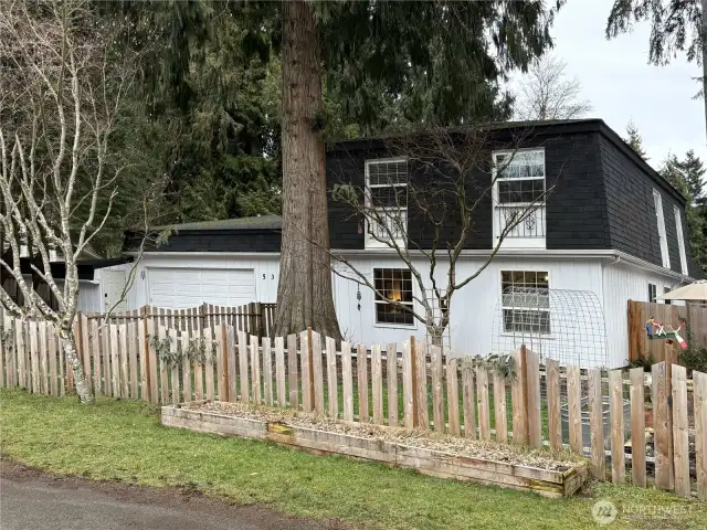 The home also includes three storage units located along the opposite side of the garage, providing ample space for organization and extra storage needs.