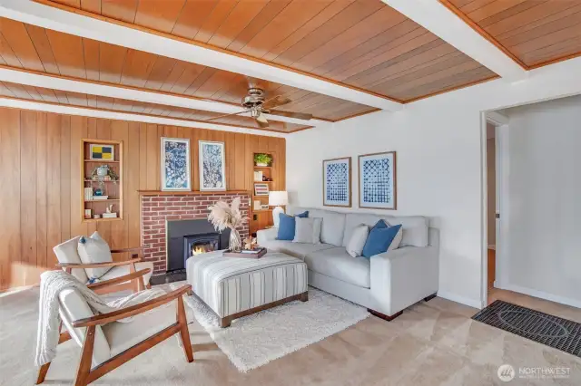 Beautiful wood planked wall and ceiling accents adorn the living room.