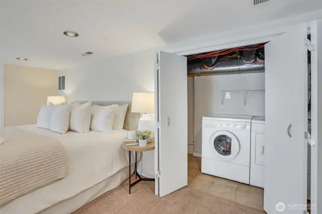 Laundry on the lower level tucked neatly inside a closet.