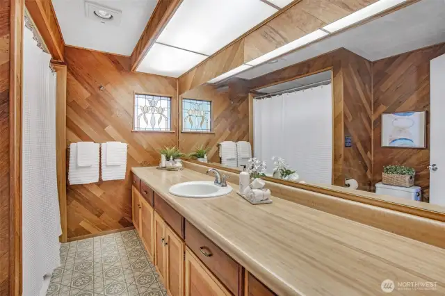 Main floor full bath has ample storage space for all your personal needs.