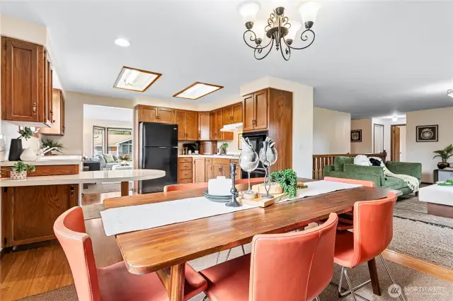 Dining open to kitchen & family room