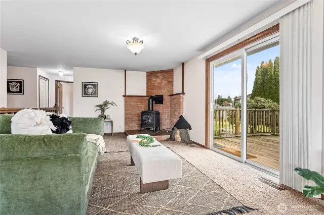 Large deck off family room leading to semi-private backyard