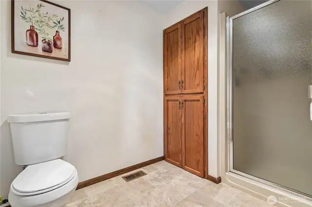 Ensuite shower/commode room with huge linen closet