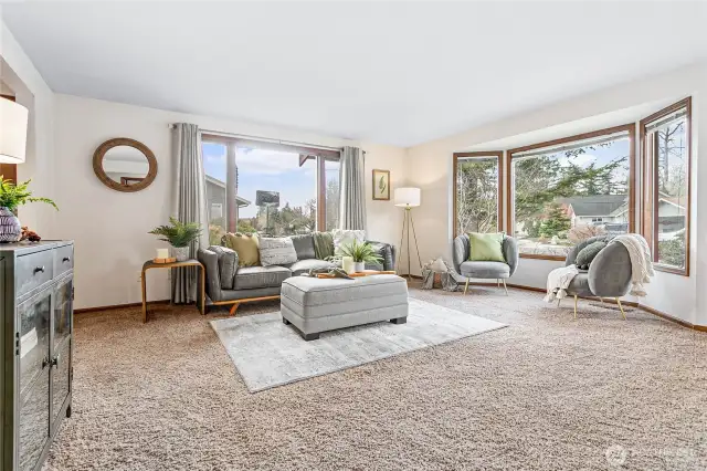Great size living room tucked in front of home