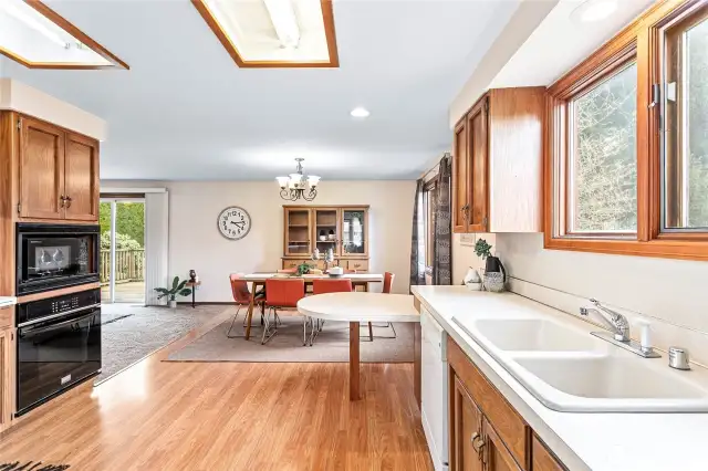 Pinterest dreams are calling in this kitchen, but great layout with plenty of light open to large dining room