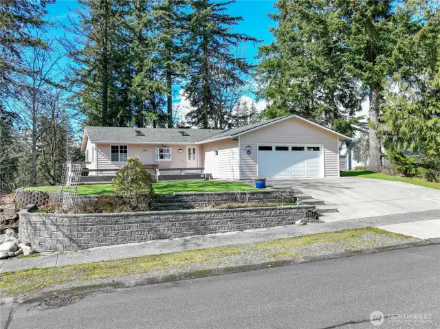 Front of home with retaining wall