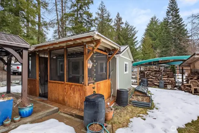 The property has all kinds of amenities. A wood stack, a tool shed, a wood shed, access to Big Creek River, a firepit, an outdoor shower, and more.