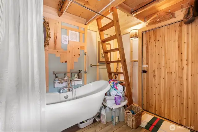 A bath tub with stairs up to a storage area or bonus loft. A mattress could be placed up there as in the dining cabin.