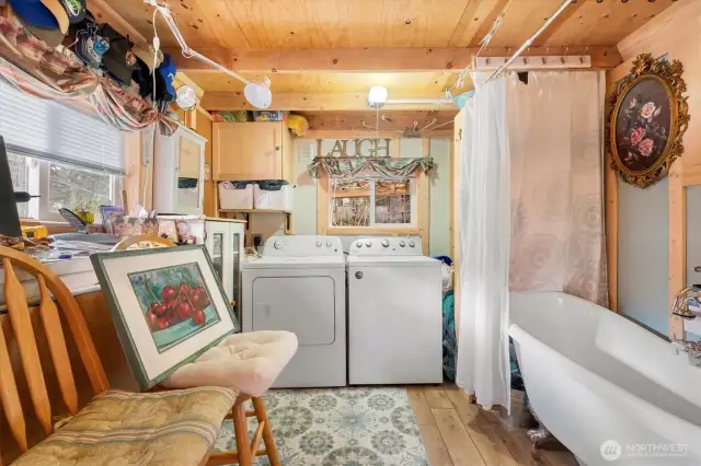 Laundry area and soaking tub.