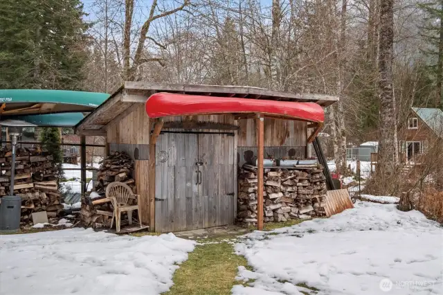 Wood stack and woodshed. It's fun to take the canoes to the priavte lake in the community.