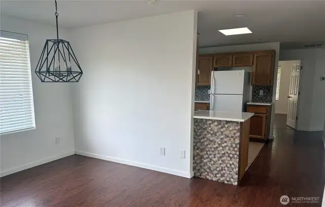 Separate dining room area between kitchen and master bedroom