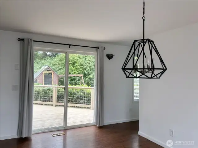 Dining area has sliding doors that lead out onto deck
