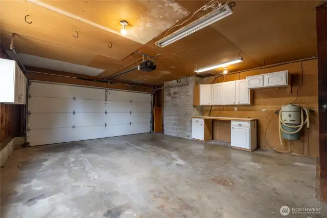 Large double car garage, with cabinetry